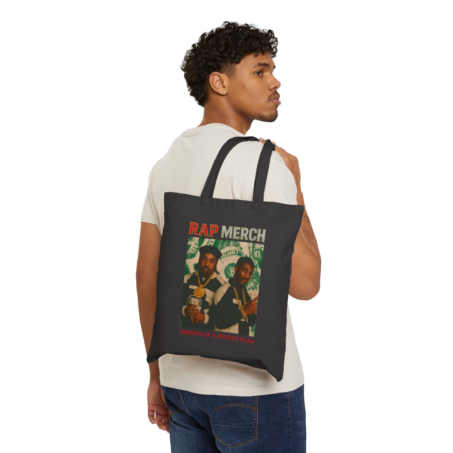Man carrying a tote bag with 'Rap Merch' design on a white background
