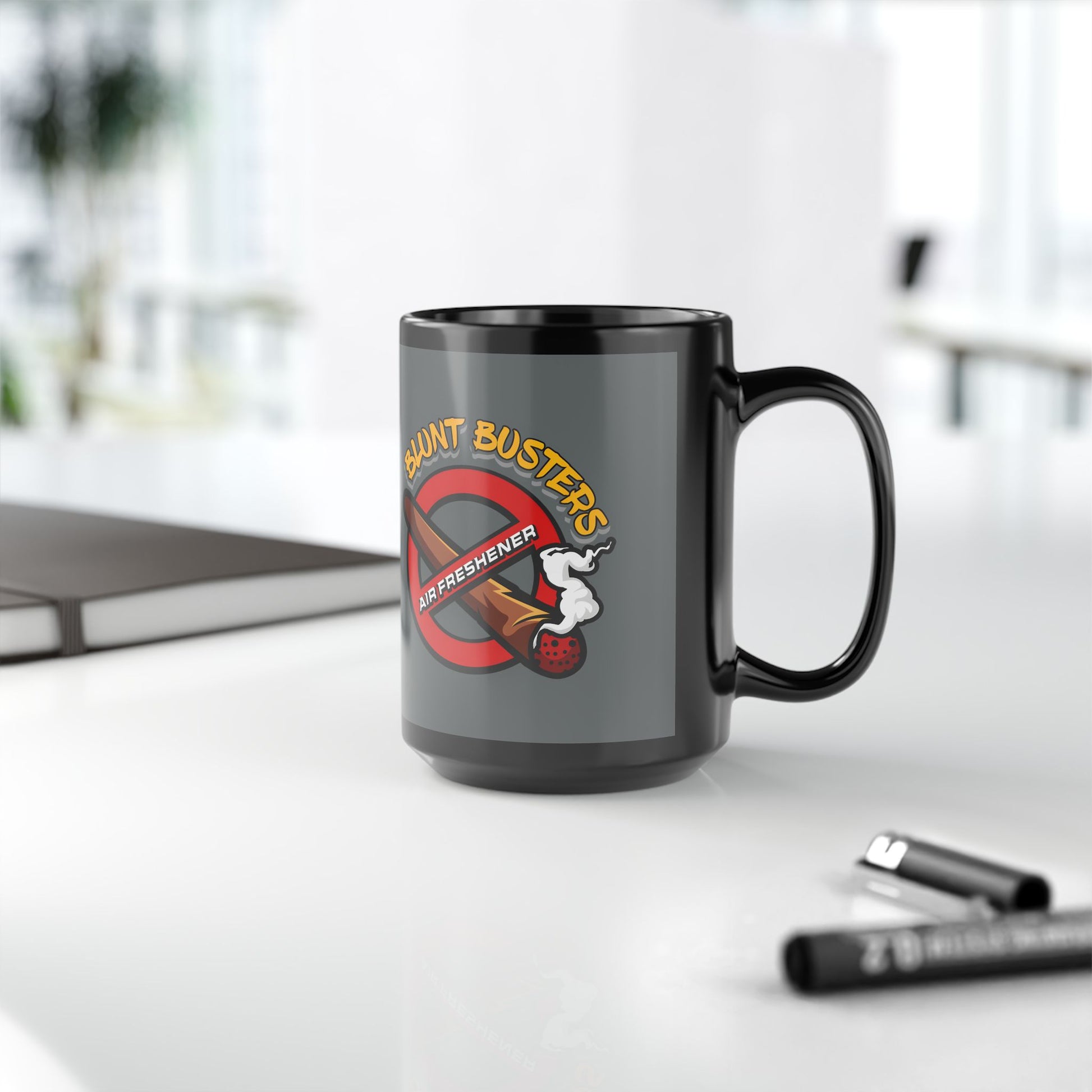 "Funny black mug with Blunt Busters air freshener design, quirky 420-friendly coffee cup."