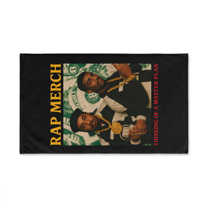 Flag with a graphic of two people and text 'Rap Merch' and 'Thinking of a Master Plan' on a black background.